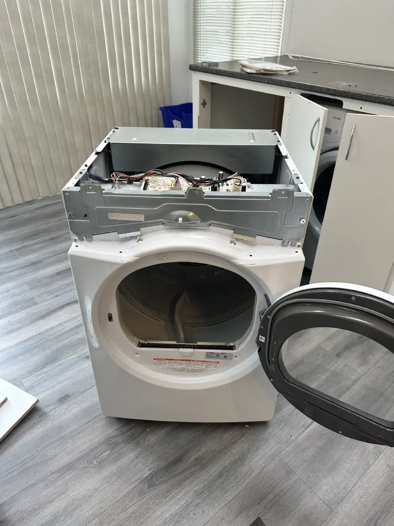 Barton Appliance Technician Fixing Dryer in Surrey