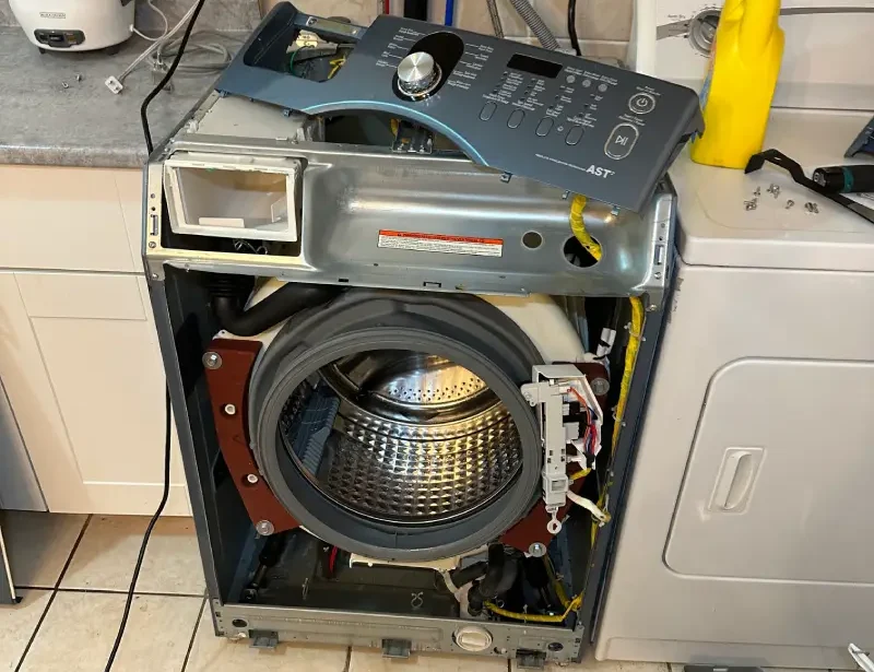 Barton Appliance Technician Fixing Dryer In Burnaby