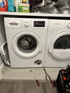 Barton Appliance Repair technician fixing an appliance in a Port Coquitlam home