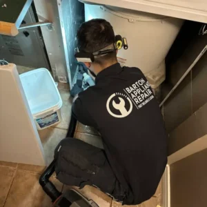 Barton Appliance Repair technician fixing an appliance in a Richmond home