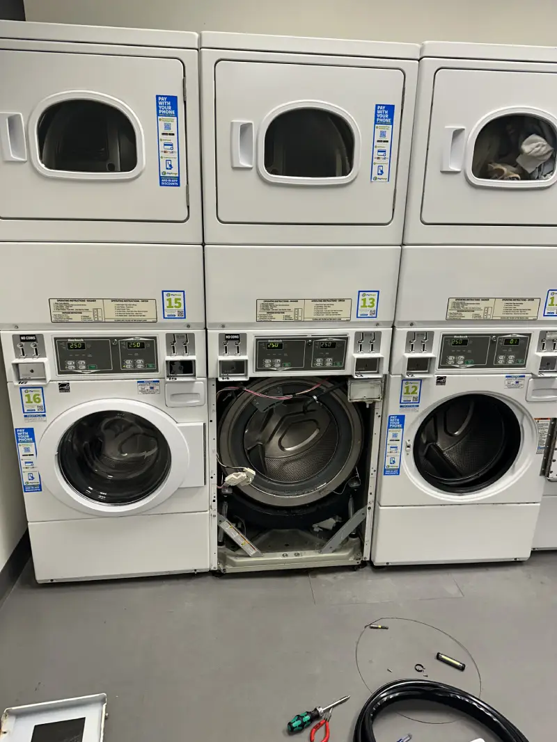 Laundry centre repair service in Vancouver BC | Barton Appliance Repair technician arriving at condo