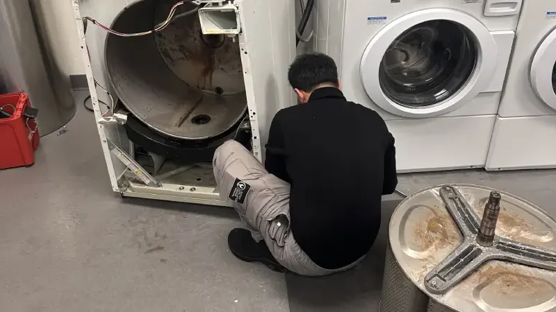Barton technician testing a dryer heating element in Vancouver